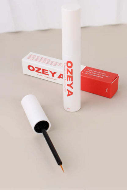 Ozeya eyeliner pen with packaging on a beige surface